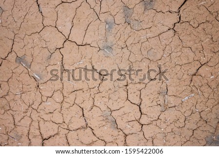 Dry surface, ground. Cracks, broken lines. Abstract texture. Vignetting.