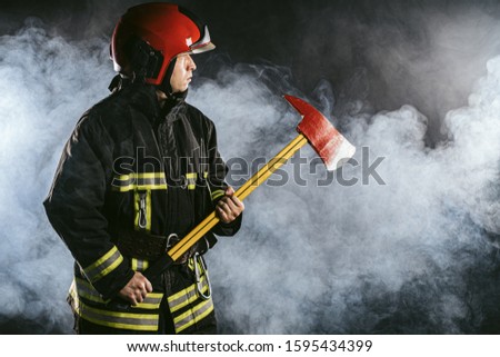 caucasian fireman hero, ready to protect all humanity from fire, professional firefighter in protective uniform