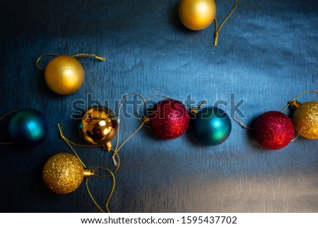 Christmas Holiday Balls isolated on a Blue  background. Colorful Christmas ball isolated on navy 
 or blue background.
