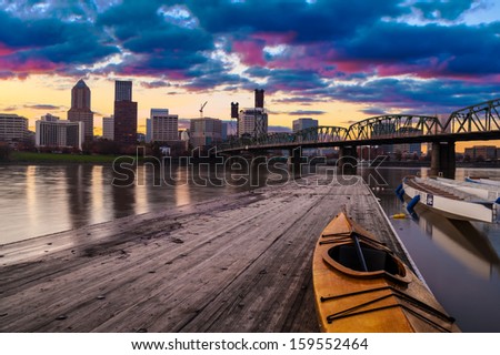 Portland, Oregon Panorama.  Sunset scene with dramatic sky and light reflections on the Willamette River.