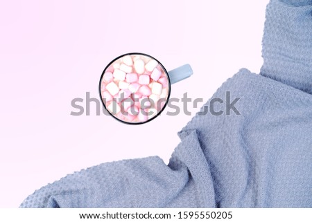 Cup of coffee with pink marshmallow with grayplaid. Copy space. Flat lay, top view