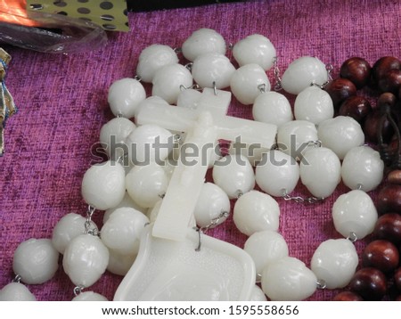 Rosary of white amber with white cross