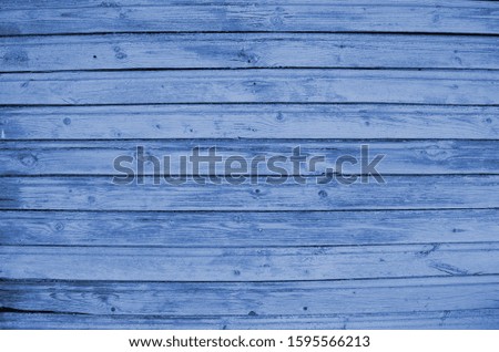The blue wood texture with natural patterns. Classic Blue color. Color of the year 2020. Trendy color.
