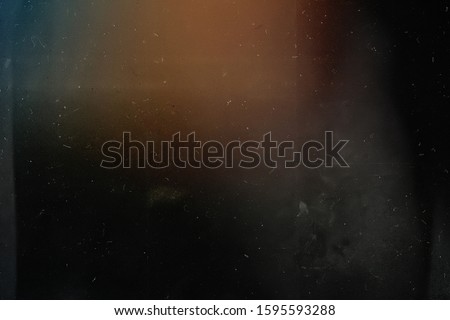 Old grunge background. Retro film photography effect. Vintage style. Mask for edit foto. Grunge texture. Lens flare and heavy grain. 70s Royalty-Free Stock Photo #1595593288