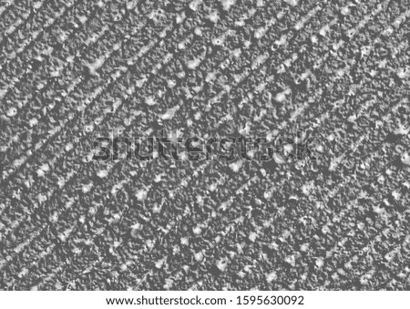 Decorative stucco texture with diagonal lines, black and white plaster background 