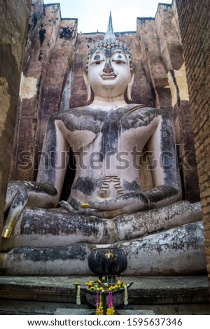 huge statue of buddha in a temple