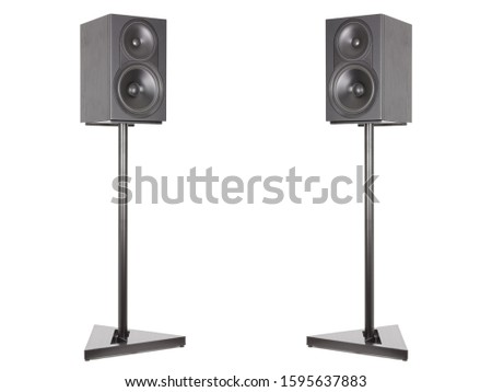 Two monitor audio studio stands and a professional horizontal speaker. Pa System Speaker. Isolated white background Royalty-Free Stock Photo #1595637883