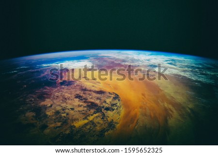 Earth and stars. Blue earth. Great for background.  The elements of this image furnished by NASA.
