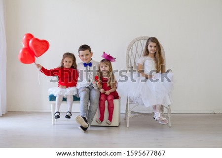 Children with red balloons on birthday party