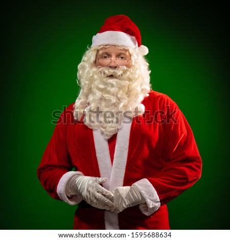 Santa Claus dancing and gesturing, posing on a green background