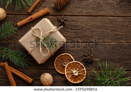 Christmas decoration with fir tree branches on wooden background, copy space