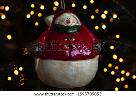 Snowman toy. Christmas tree decoration, snowman in Santa outfit. Christmas toys. New year’s toys. New year’s ball 