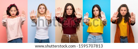Set of women over isolated colorful background making stop gesture and disappointed