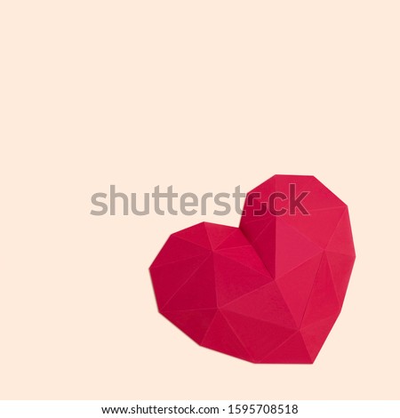Polygonal paper heart. Creative layout for Valentine's Day. Paper art and craft in holiday design. Volumetric handmade paper object. Square image