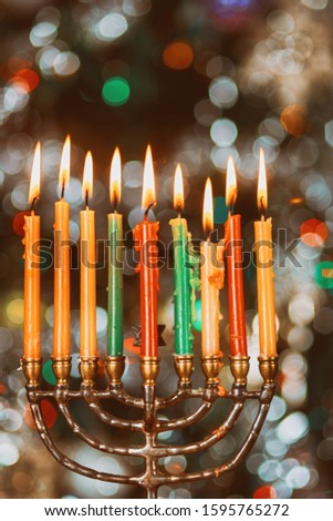 Jewish holiday symbol Hanukkah Menorah brightly glowing soft focus
