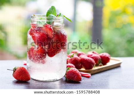 fresh Strawberry mojito cocktail with ice and mint in glass fruit to make water in the summer.
