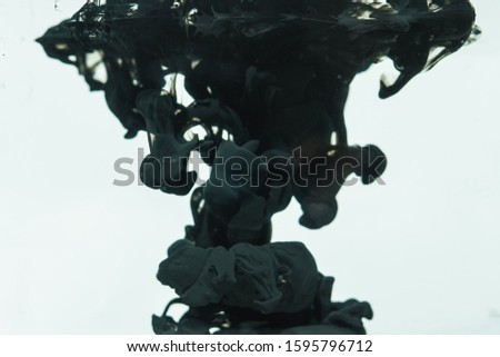 Picture of pen ink being drowned in water