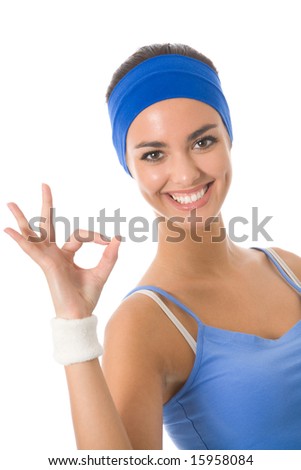 Young happy woman in sports wear gesturing, isolated on white