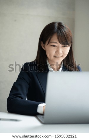 Young business woman working in office