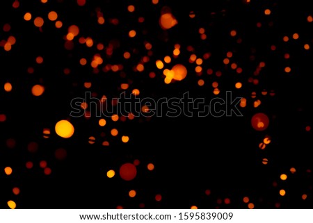 Christmas and happy new year decoration light. Red and orange color bokeh background with beautiful pattern. Defocused Xmas light in the night of party. Christmas holiday bokeh background. 