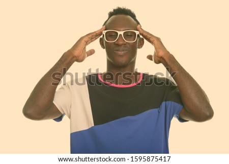 Young black African man having headache
