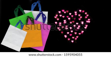 ECO Friendly Gift Bags, Non Woven Shopping Bags with Colorful Hearts on Black Background. Eid Gift for you. 