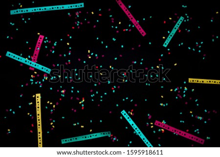 Night party concepts with colorful confetti paper on dark background.celebrate design material