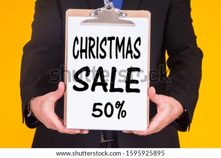 businessman announcing sales and Christmas discounts