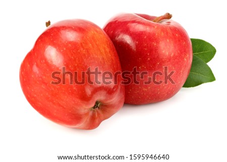 two red apples with green leaves isolated on white background
