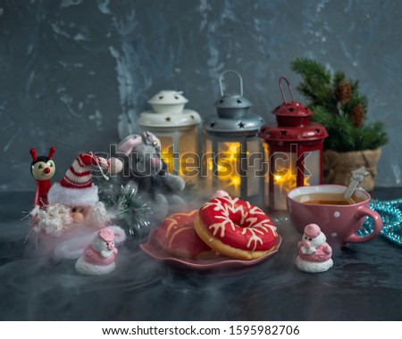 Tea party on a magical Christmas evening, Christmas card with Christmas toys and sweet painted cakes