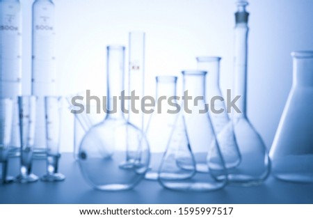 Group of laboratory glassware on light background, Concept of health care, Symbolic of science, Science professional's photo