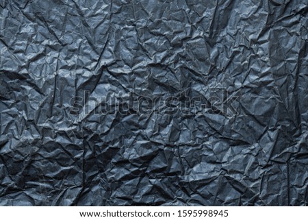 Flat lay, Close-up texture of Crumpled black paper background abstract. Detail texture of pattern with free space copy for text.