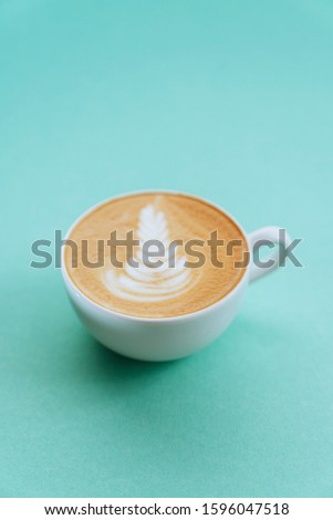 two Cup of coffee cappuccino on color background