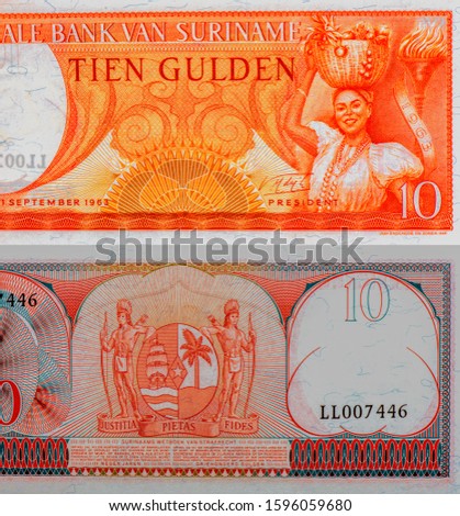 Woman with basket full of fruits. Portrait from Suriname 10 Gulden 1963 Banknotes. 