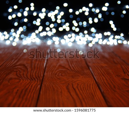 Blur christmas lights on wooden planks