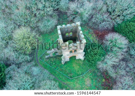 Drone shot of tower with woodland