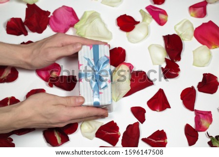 Gift box on background of rose petals. Valentine day, mother day, wedding, 8 march of concept. Gift stock images
