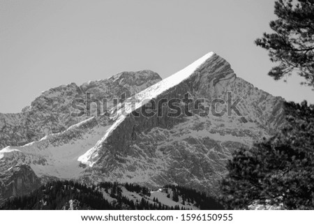 Snow covered peak of the Alpspitze in the Wetterstein mountains, black and white photo, Alps, Bavaria, Germany