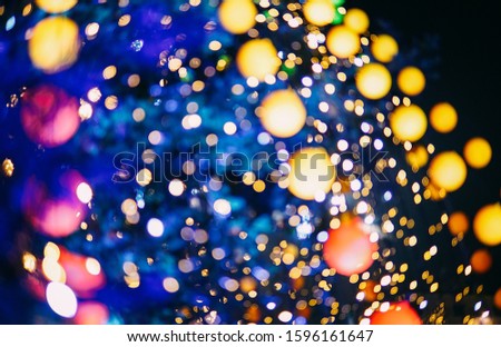 New year composition. Stylish decor concept, christmas lights on fir-tree. Bokeh abstract effect. For postcard. Festive backdrop, copy space.  