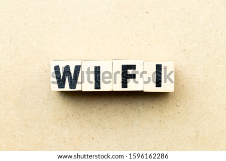 Letter block in word wifi on wood background