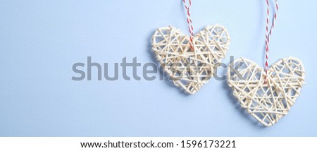 Two Handmade Hearts on blue background. Valentine's or Mother's day banner mockup with symbols of love. Flat lay, top view, copy space.