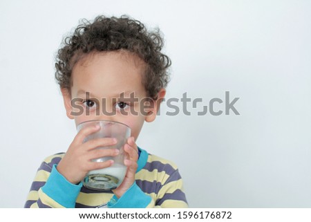 boy drinking milk for breakfast on white background stock photography stock photo 