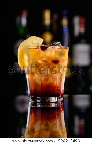 Americano or Negroni cocktail with orange slice in the rocks glass, classic alcoholic orange cocktail Beefeater Negroni