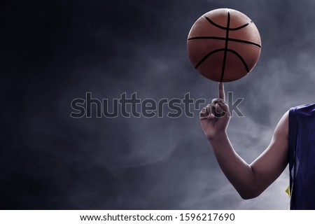 Basketball player spinning a ball 
