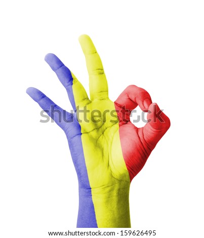 Hand making Ok sign, Romania flag painted as symbol of best quality, positivity and success - isolated on white background