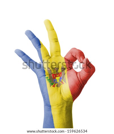 Hand making Ok sign, Moldova flag painted as symbol of best quality, positivity and success - isolated on white background