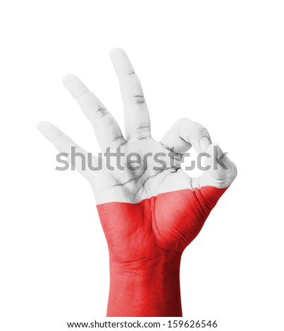 Hand making Ok sign, Poland flag painted as symbol of best quality, positivity and success - isolated on white background