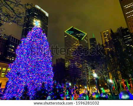 Christmas tree during holidays at night in Millennium Park.