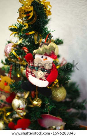 Selective focus vintage toys hanging on Christmas tree. New year 2020.