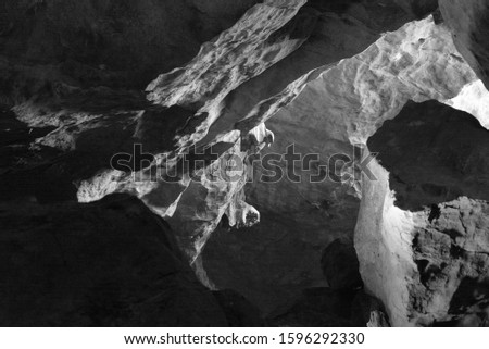 Rock Wall Texture in a Cave Beautiful Lights Coming Through  tunnel landscape background black and white